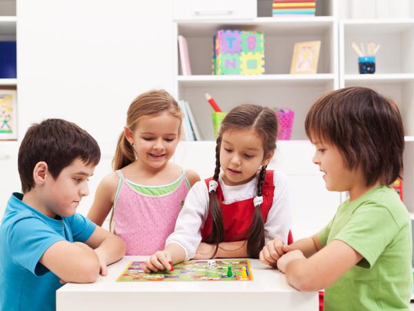 Kids playing board game