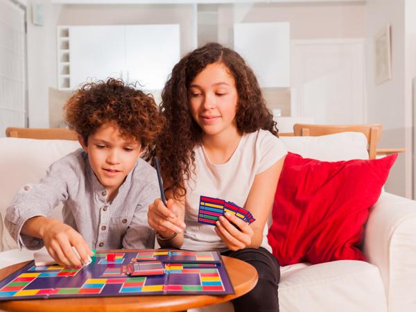 Two children playing a board game